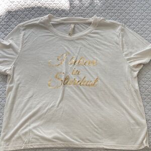 White Graphic Tee with Gold Script "I believe in Stardust"
